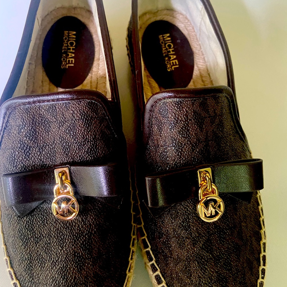 Lady Micheal Kors slip on shoes.